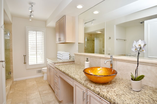 32824 Outland Trl, Bingham Farms, MI 48025 - full bath with track lighting, vanity, visible vents, plenty of natural light, and a shower stall