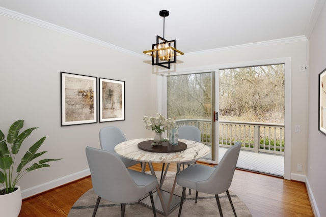 32824 Outland Trl, Bingham Farms, MI 48025 - dining area with crown molding, a chandelier, and wood finished floors