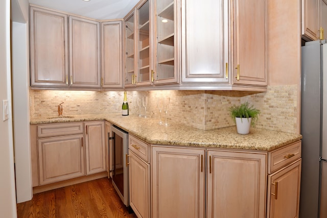 32824 Outland Trl, Bingham Farms, MI 48025 - bar with decorative backsplash, wood finished floors, a sink, freestanding refrigerator, and wine cooler