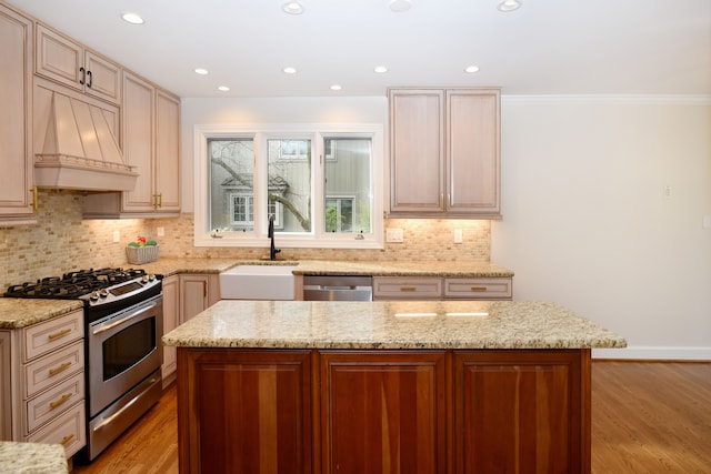 32824 Outland Trl, Bingham Farms, MI 48025 - kitchen with premium range hood, light wood-type flooring, tasteful backsplash, a sink, and stainless steel appliances