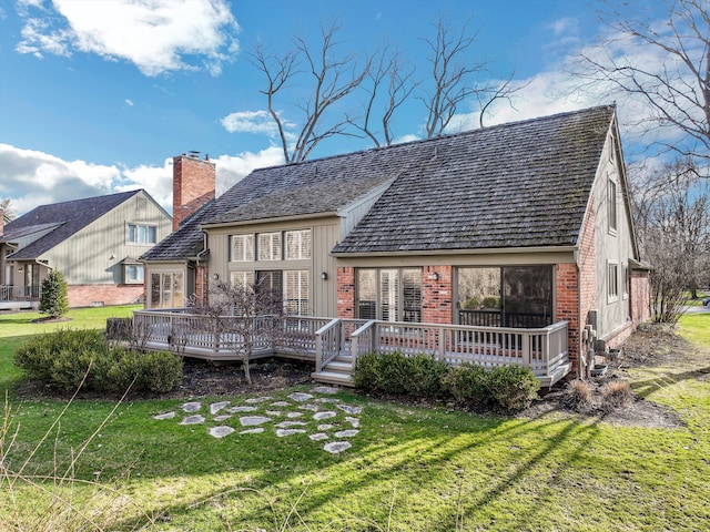 32824 Outland Trl, Bingham Farms, MI 48025 - back of house featuring brick siding, a wooden deck, a yard, and a chimney