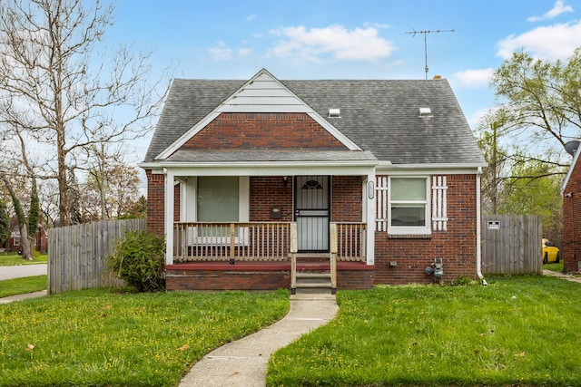 16516 Collingham Dr, Detroit, MI 48205 - view of front facade featuring brick siding, a shingled roof, fence, and covered porch