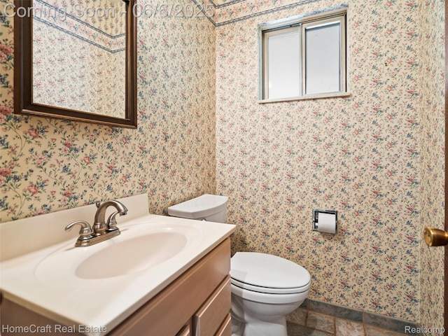 28210 Ridgebrook Rd, Farmington Hills, MI 48334 - half bathroom with vanity, toilet, wallpapered walls, and baseboards