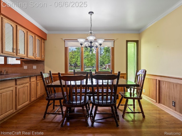 28210 Ridgebrook Rd, Farmington Hills, MI 48334 - dining room featuring a chandelier, dark wood finished floors, ornamental molding, and wainscoting