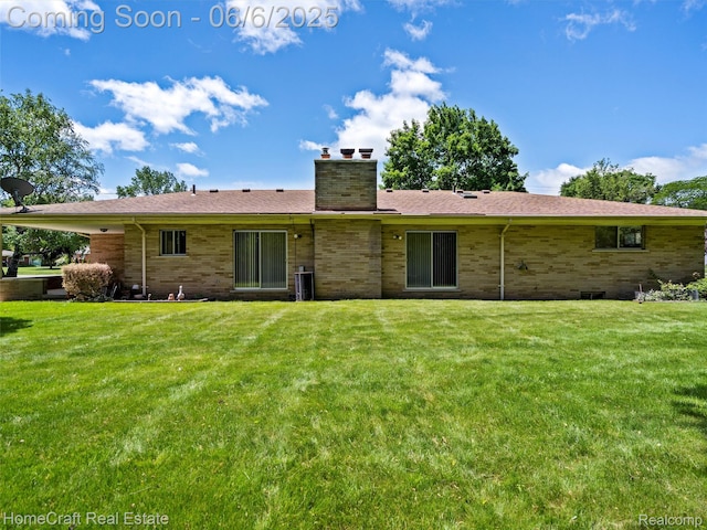 28210 Ridgebrook Rd, Farmington Hills, MI 48334 - back of property featuring a chimney, a lawn, and brick siding