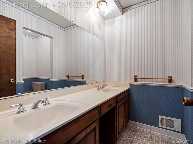 28210 Ridgebrook Rd, Farmington Hills, MI 48334 - full bath featuring wallpapered walls, double vanity, tile patterned flooring, and toilet