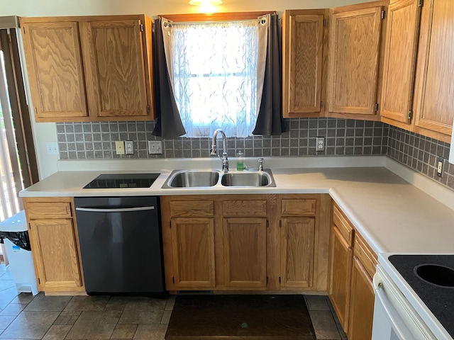 kitchen with a sink, light countertops, stainless steel dishwasher, and backsplash
