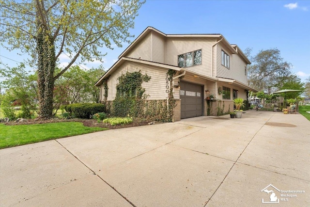 30500 Bayview St, Gibraltar, MI 48173 - view of side of property with driveway and a garage