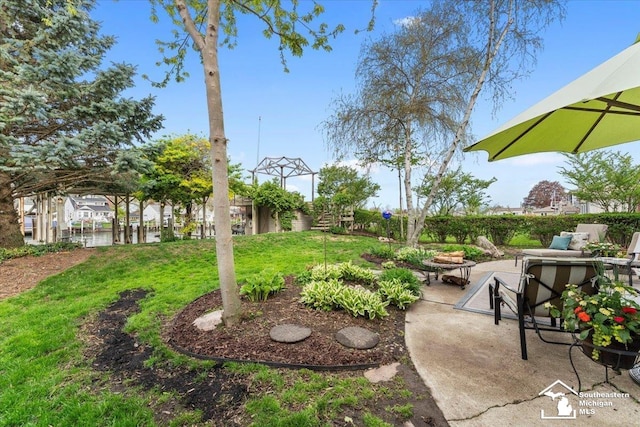exterior space with an outdoor fire pit, a patio area, and a yard