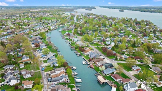 birds eye view of property featuring a residential view and a water view