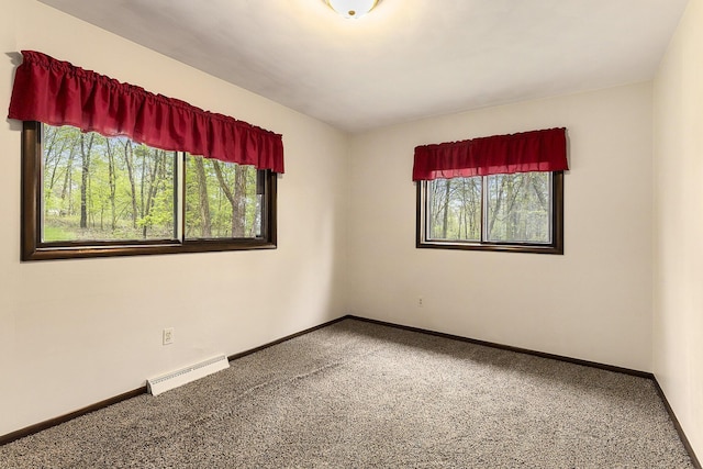 carpeted empty room with baseboards and visible vents