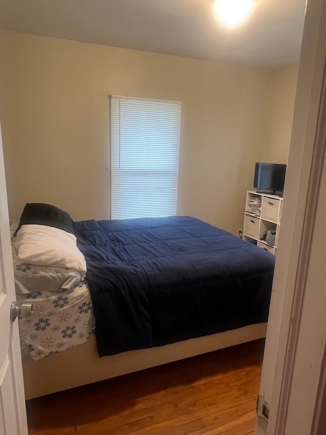 bedroom featuring wood finished floors