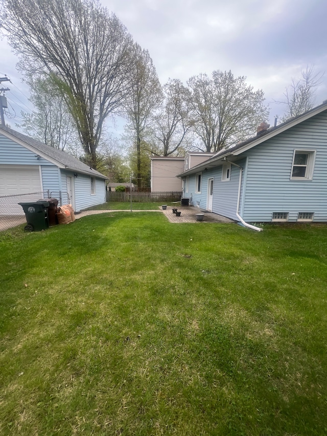 view of yard featuring a patio and fence