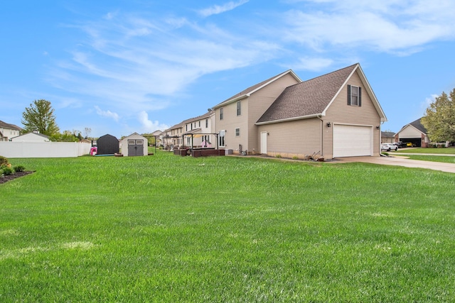 15000 Tiara Ave, Monroe, MI 48161 - exterior space featuring a storage shed, an outdoor structure, concrete driveway, a garage, and a wooden deck