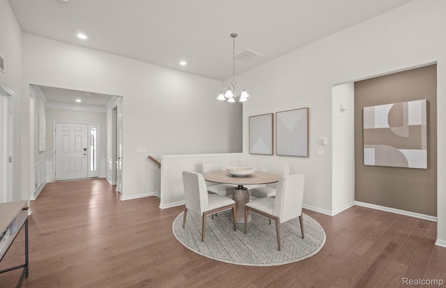 16217 Conifer Ln, Clinton Township, MI 48038 - dining room featuring wood finished floors, a chandelier, recessed lighting, and ornamental molding