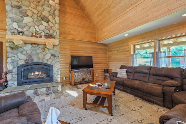 living room with a stone fireplace, wood ceiling, wood finished floors, and high vaulted ceiling