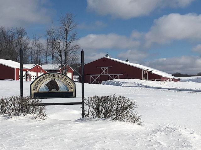 exterior space with a barn and an outbuilding