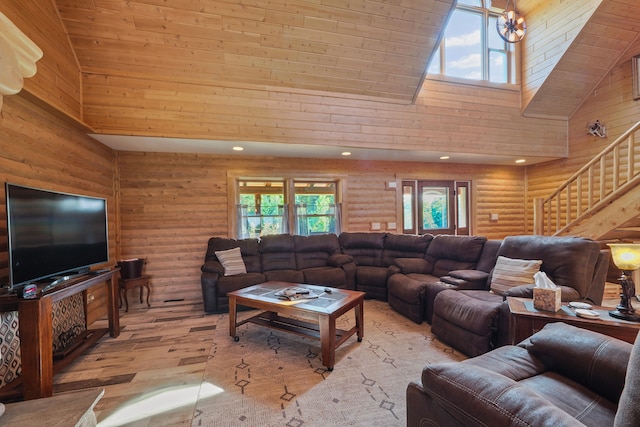 living room featuring recessed lighting, high vaulted ceiling, log walls, and hardwood / wood-style flooring