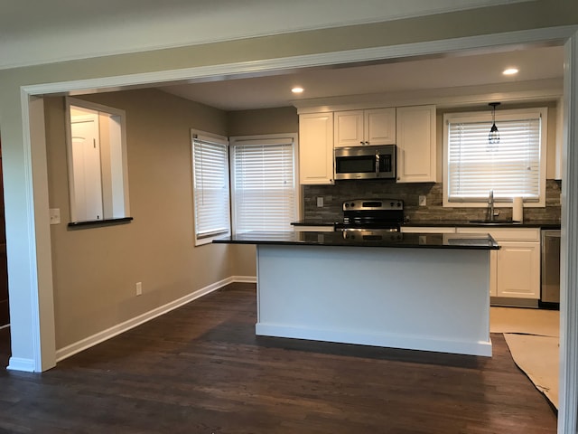 800 Cambridge Rd, Berkley, MI 48072 - kitchen featuring stainless steel appliances, a sink, dark countertops, white cabinets, and recessed lighting