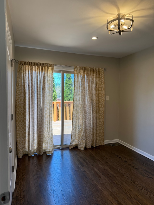 800 Cambridge Rd, Berkley, MI 48072 - unfurnished room with baseboards, wood finished floors, recessed lighting, and a chandelier