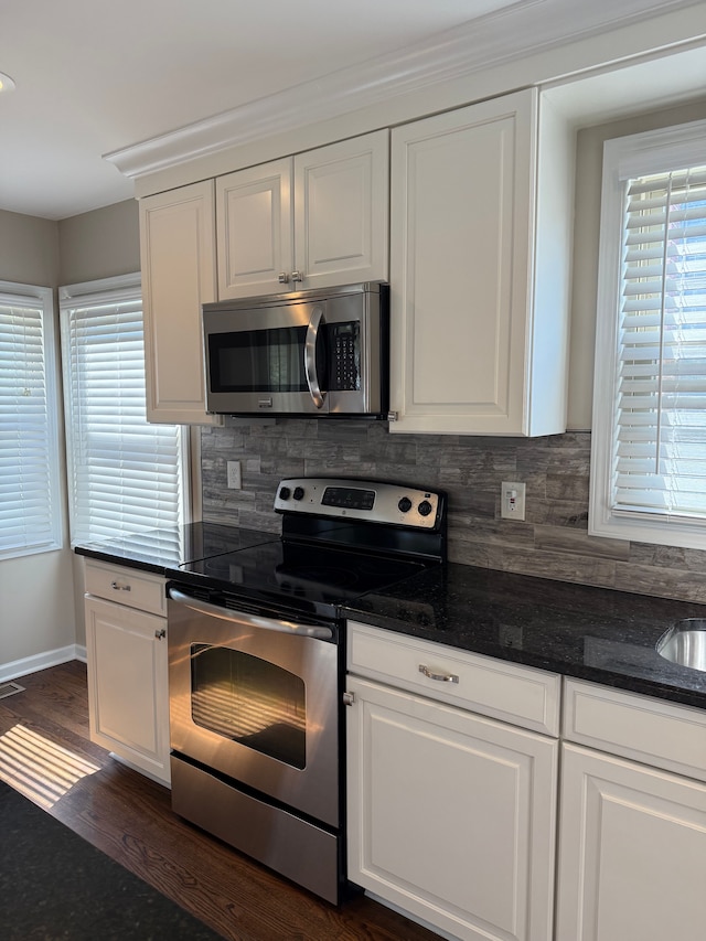 800 Cambridge Rd, Berkley, MI 48072 - kitchen with appliances with stainless steel finishes, decorative backsplash, and white cabinetry