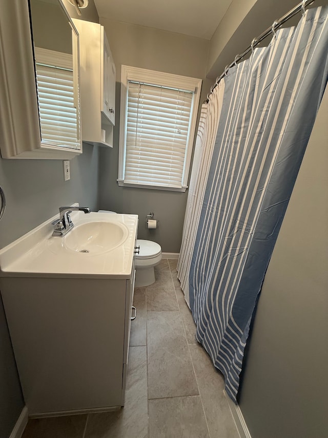 800 Cambridge Rd, Berkley, MI 48072 - full bathroom featuring vanity, baseboards, toilet, a shower with curtain, and tile patterned floors