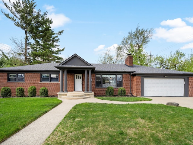 ranch-style house with brick siding, a chimney, an attached garage, concrete driveway, and a front lawn