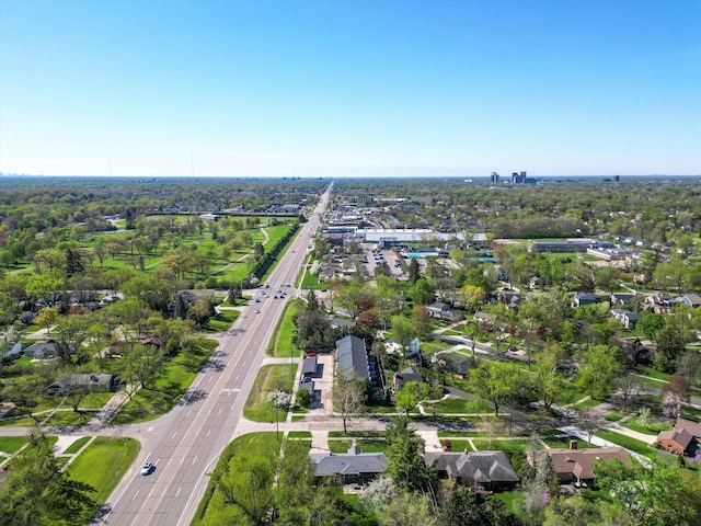 aerial overview of property's location with a highway and nearby suburban area