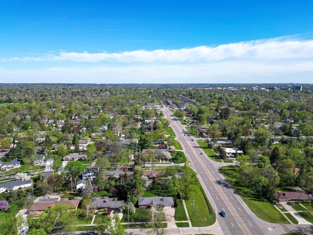 aerial view of property and surrounding area with nearby suburban area