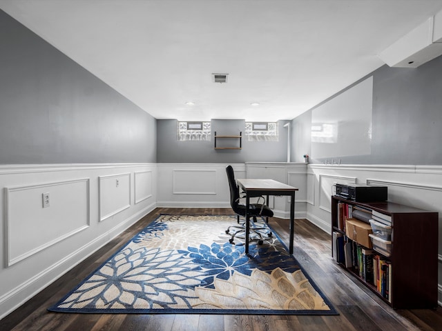office space featuring wood finished floors and wainscoting