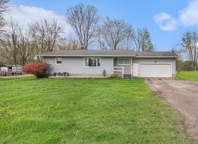 ranch-style house featuring an attached garage, a chimney, driveway, and a front lawn