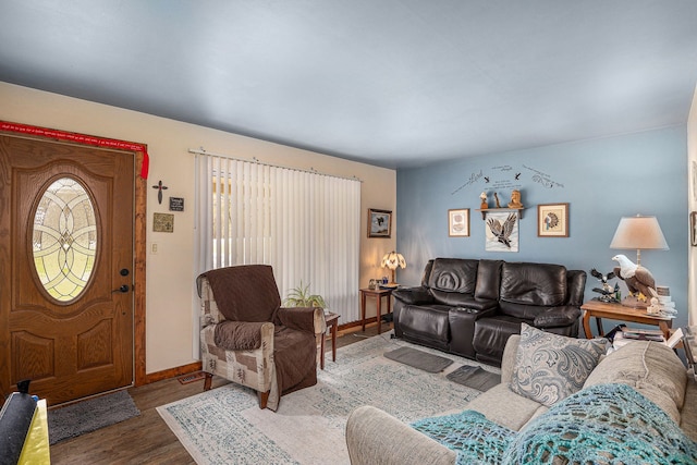 living room with baseboards and wood finished floors