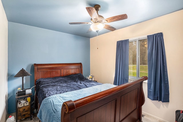 bedroom with baseboards, a ceiling fan, and carpet flooring