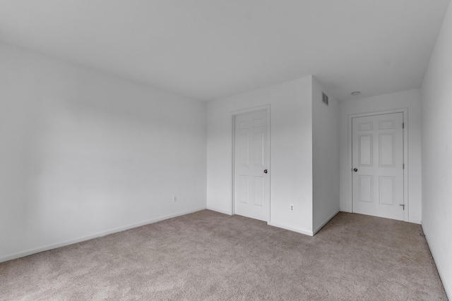 9080 Emerson Dr, Saline, MI 48176 - unfurnished bedroom with visible vents, carpet, and baseboards