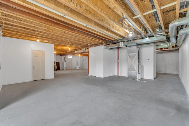 9080 Emerson Dr, Saline, MI 48176 - unfinished basement featuring heating unit