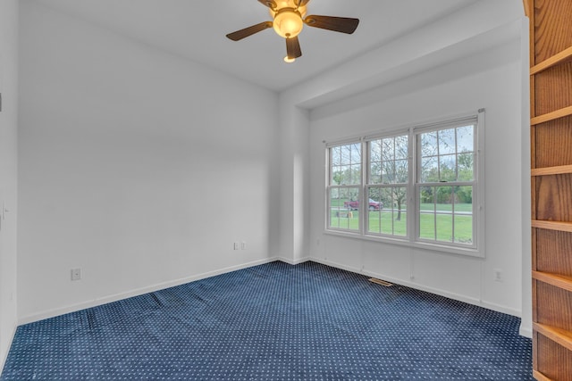 9080 Emerson Dr, Saline, MI 48176 - spare room with dark carpet, baseboards, and ceiling fan