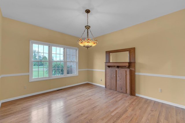 9080 Emerson Dr, Saline, MI 48176 - empty room with baseboards, visible vents, and light wood-style floors
