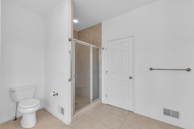 9080 Emerson Dr, Saline, MI 48176 - full bathroom with visible vents, toilet, baseboards, tile patterned floors, and a stall shower