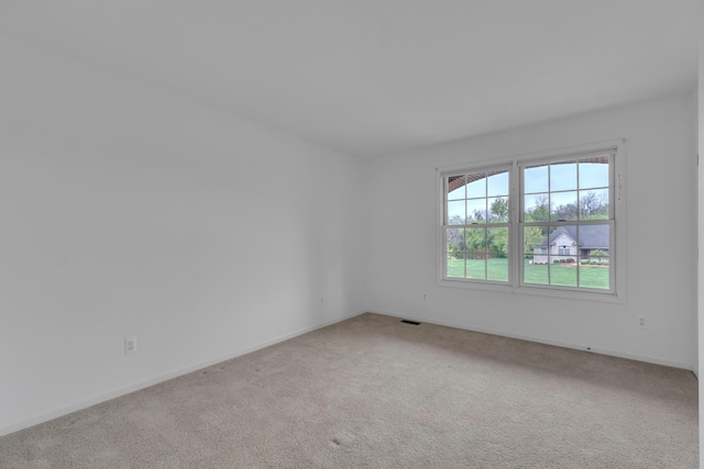 9080 Emerson Dr, Saline, MI 48176 - carpeted spare room featuring baseboards