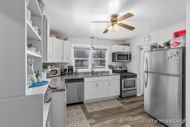 kitchen with a sink, white cabinetry, appliances with stainless steel finishes, and ceiling fan