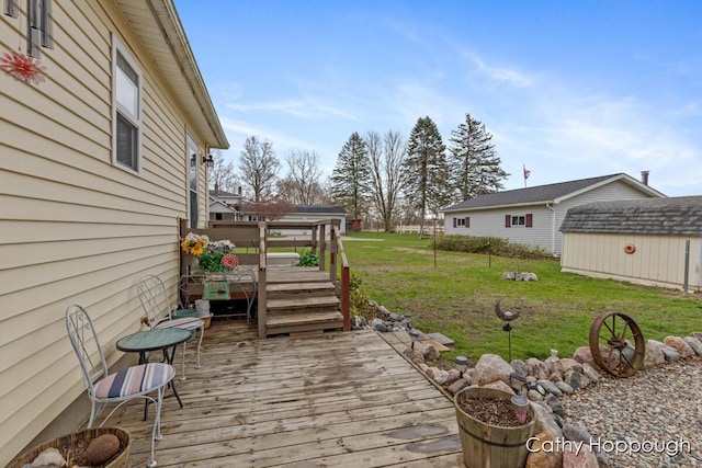 view of yard with an outdoor structure and a deck