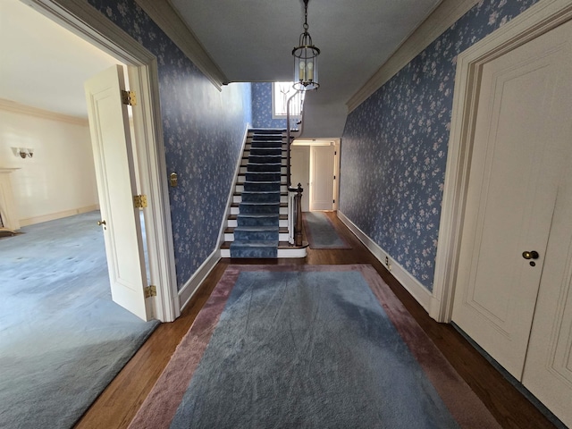 staircase featuring wallpapered walls and wood finished floors