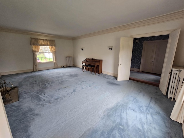 unfurnished living room featuring baseboards, ornamental molding, radiator heating unit, and carpet