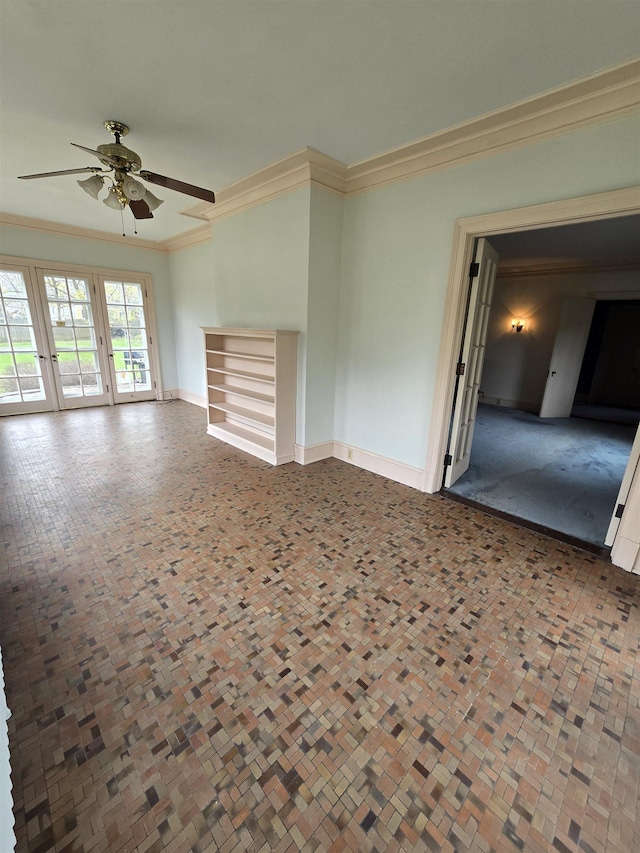 unfurnished living room featuring crown molding, a ceiling fan, and baseboards