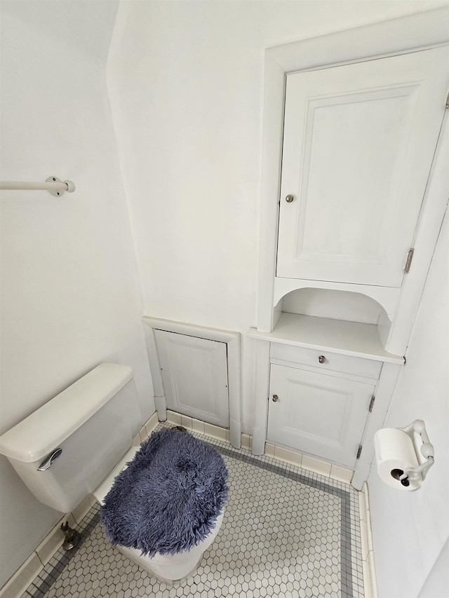 bathroom featuring tile patterned flooring and toilet