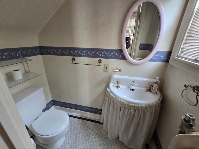 bathroom with toilet and a sink