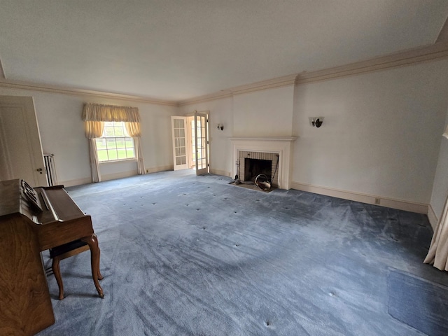 unfurnished living room featuring baseboards, a fireplace with flush hearth, ornamental molding, and carpet