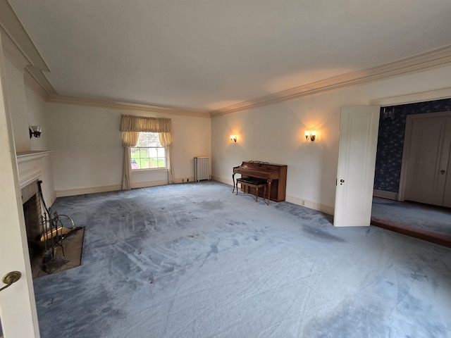 unfurnished living room with crown molding, a fireplace, baseboards, radiator heating unit, and carpet flooring