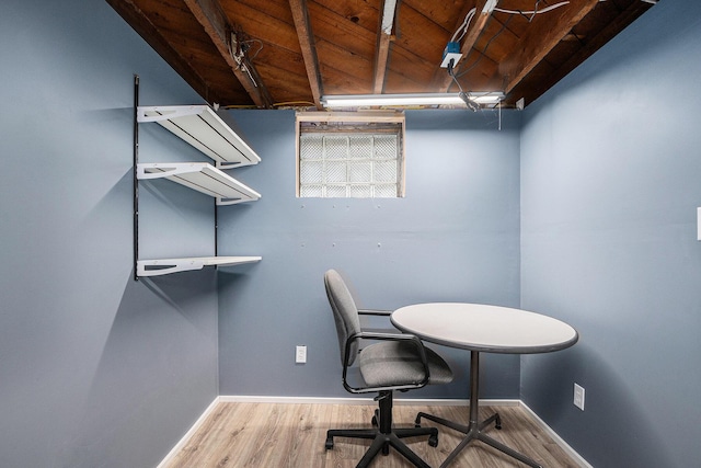 office space with baseboards, wood ceiling, and wood finished floors