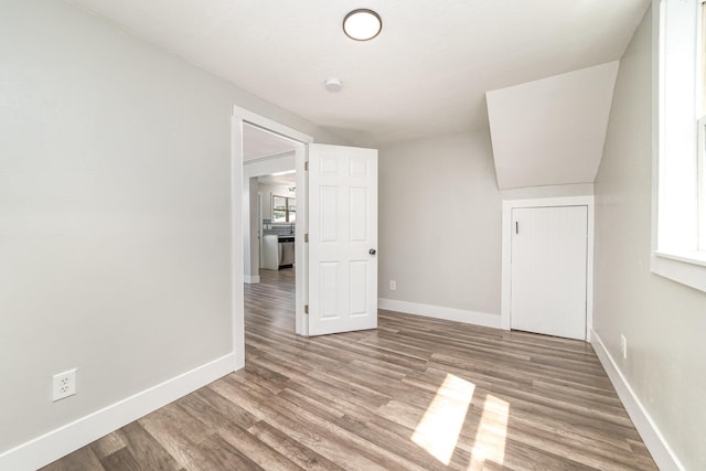 507 S Lincoln St, Bay City, MI 48708 - bonus room featuring baseboards and wood finished floors